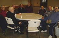 Monday morning group meets weekly at Center Hill building. Taken Dec. 31. Clockwise from left foreground: J.T. Ashby, Donis Simpson, Mel Sonney, Carlton Bryson, Jearl Howard, Vernon Lacey, Dalton Shewbuirt, Bryan Sowell.